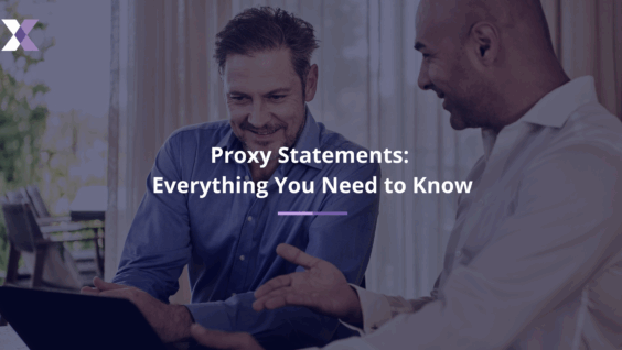 Two smiling men view a laptop screen to represent proxy statements: everything you need to know